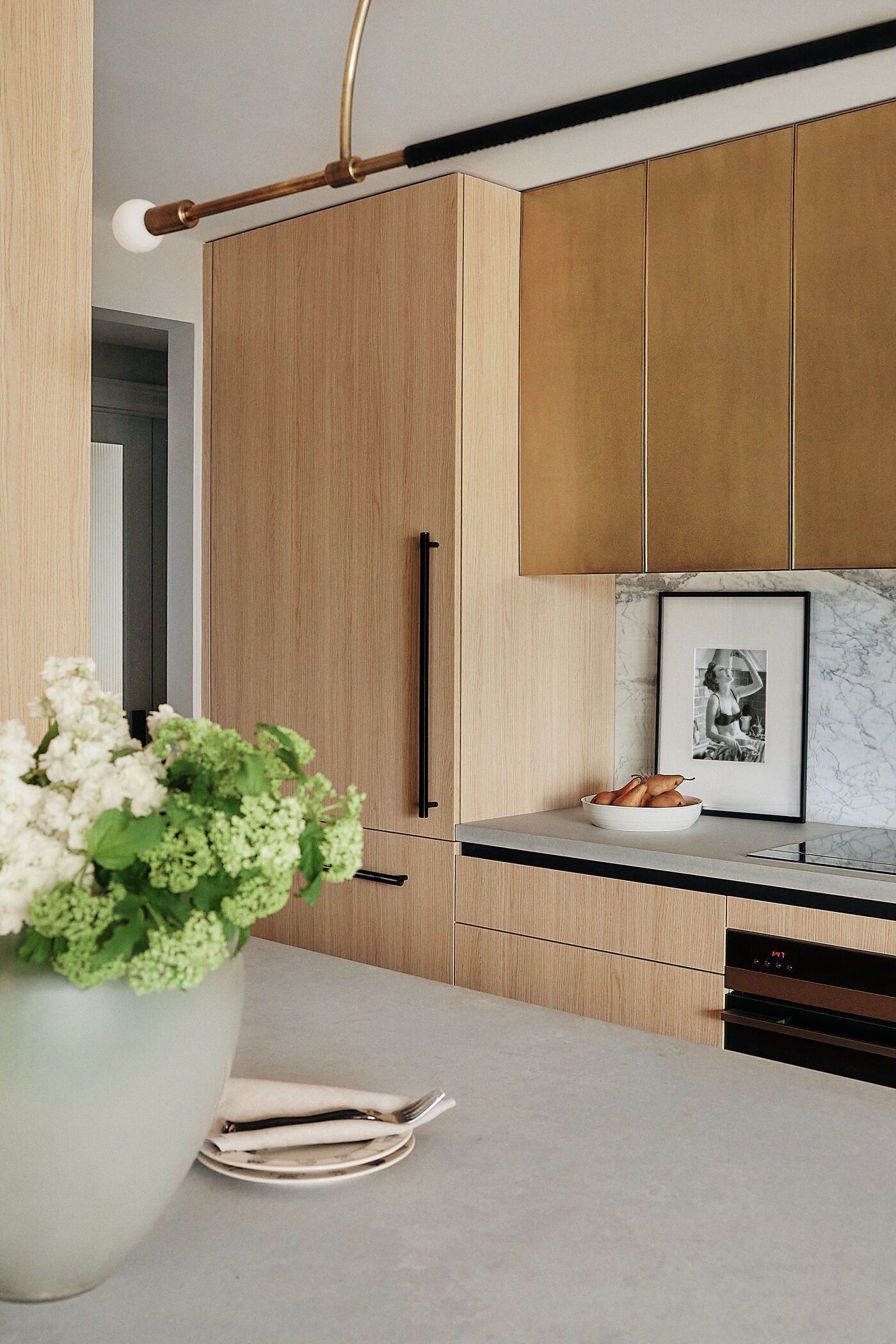 Brass and white oak kitchen