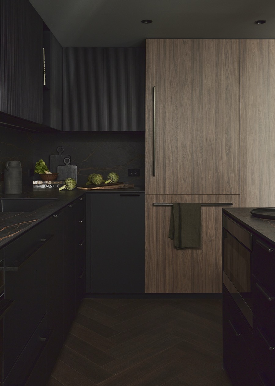 Dark kitchen with fluted wood and stone, Fairview Road Residence